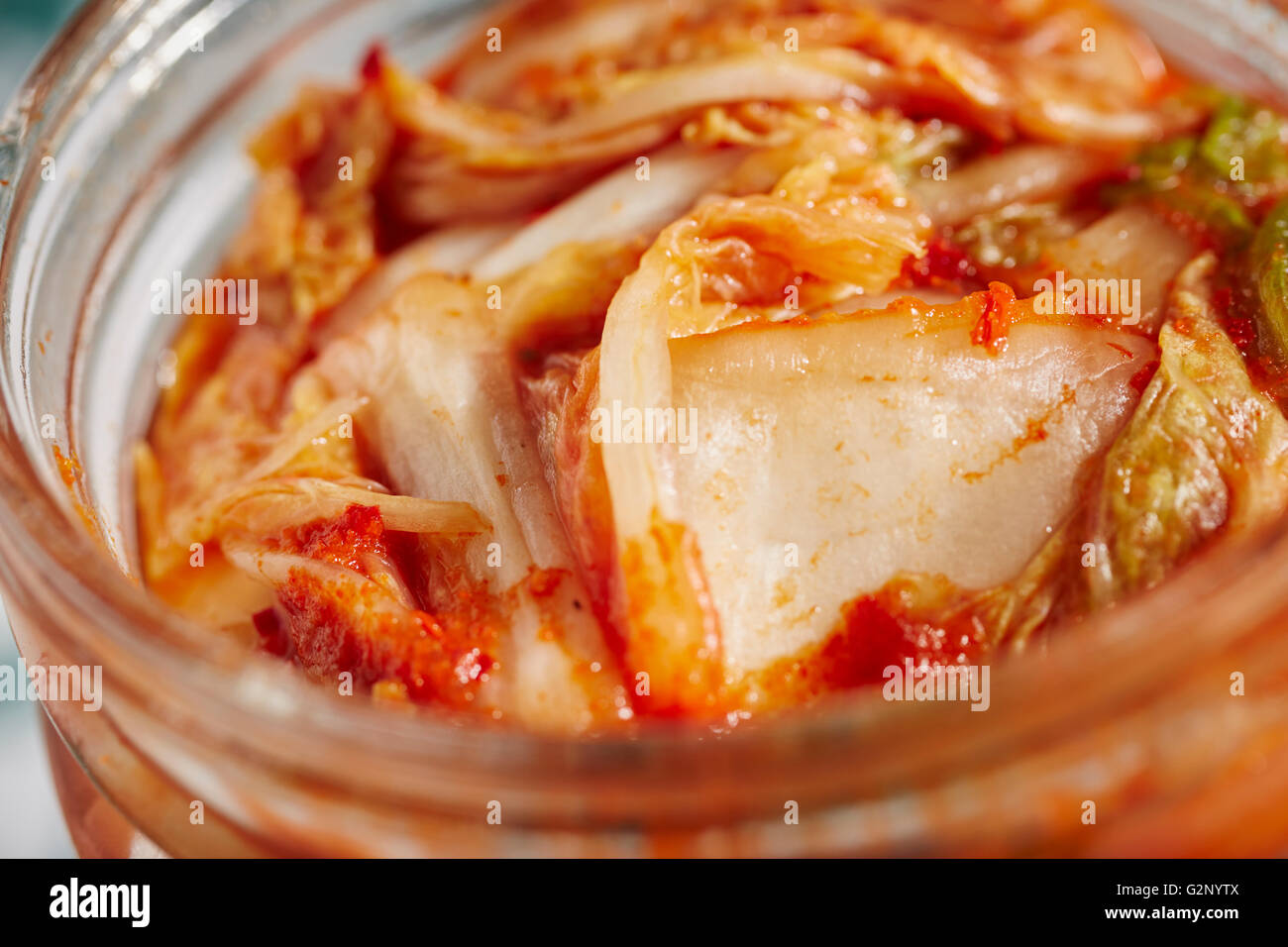 A jar of kimchi; spicy Korean preseved vegetables Stock Photo