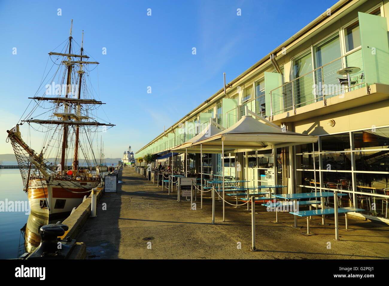 The Lady Nelson docked in front of cafés at Elizabeth Street Pier in Hobart, Tasmania, Australia. Stock Photo