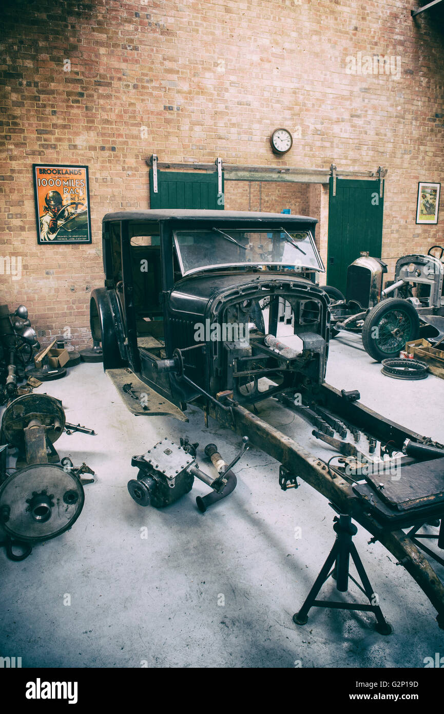 Vintage Bentley restoration workshop at Bicester Heritage Centre. Oxfordshire, England. Vintage filter applied Stock Photo