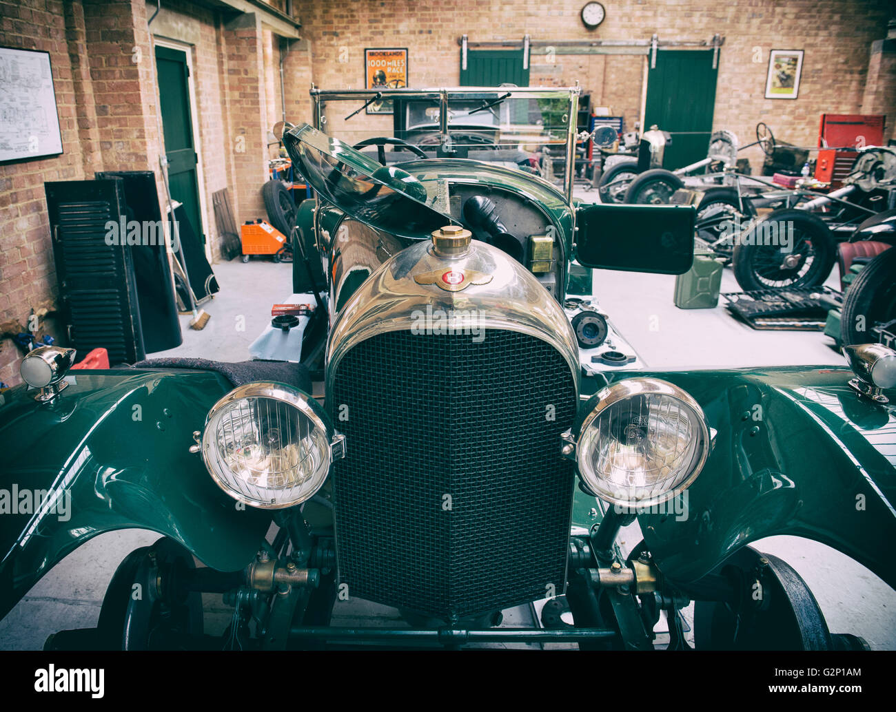 Vintage Bentley restoration workshop at Bicester Heritage Centre. Oxfordshire, England. Vintage filter applied Stock Photo