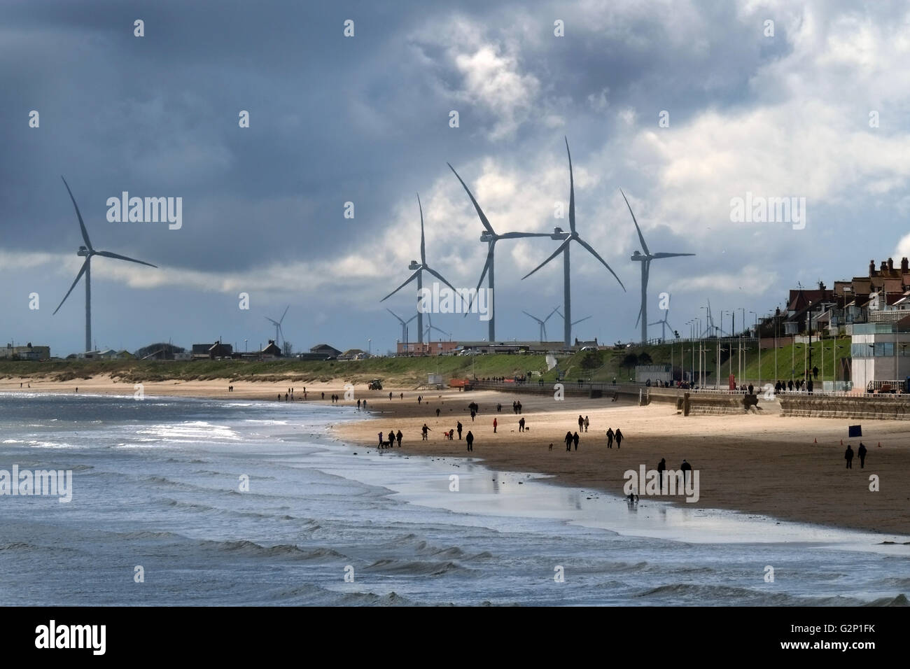 Wind turbines near a coastal resort in Yorkshire, UK. Stock Photo