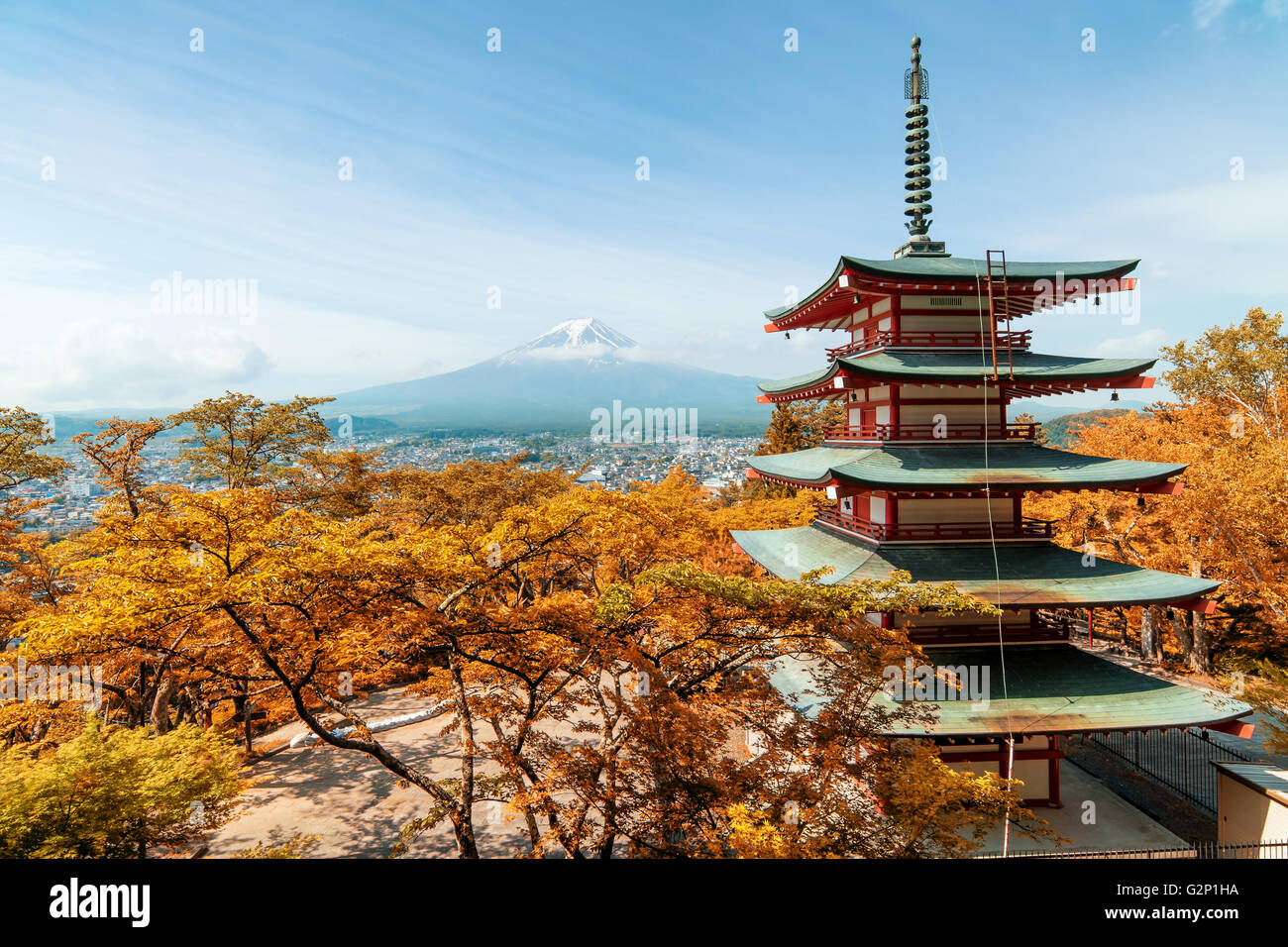 Travel in Japan - Beuatiful autumn in Japan at Red pagoda with Mt. Fuji in background, Japan. Stock Photo