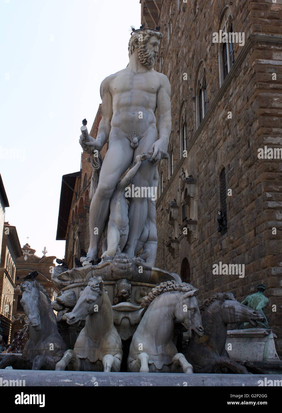 The Fountain of Neptune in the Piazza della Signoria (a square in front of the Palazzo Vecchio) Florence, Italy. It was commissioned in 1565 and is by the sculptor Bartolomeo Ammannati, the design however was done by Baccio Bandinelli before he died. The sculpture is made from Apuan Marble, and is meant to represent the Florentine dominion over the sea. It was commissioned for a wedding, and the face of Neptune resembles that of Cosimo I de'Medici, Duke of Florence/Grand Duke of Tuscany, and father of the groom. Stock Photo
