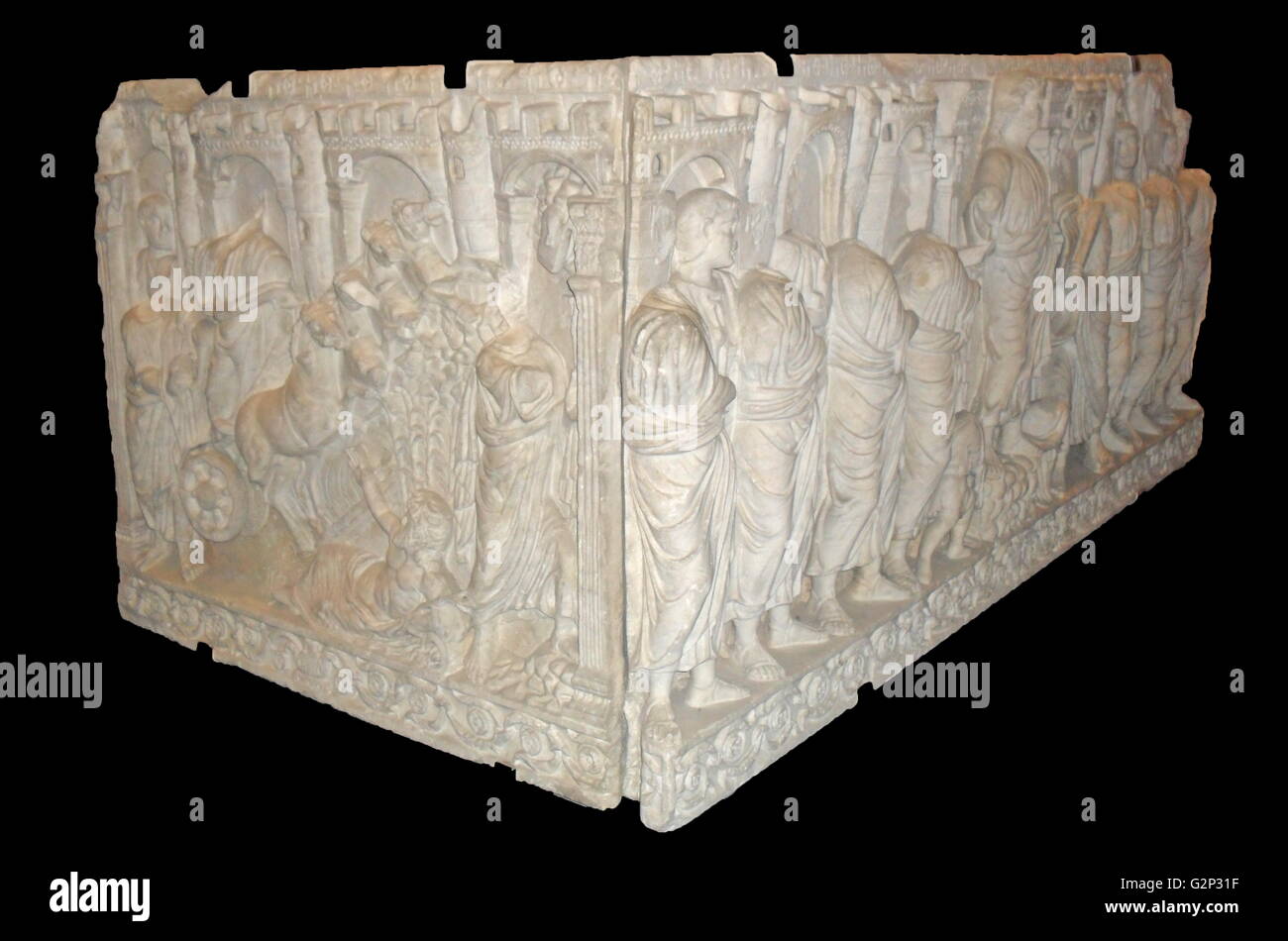 Roman Sarcophagus. Last decades of the 4th century. Detailed with a relief of crenelated towers, Christ and his followers, and Moses receiving the 10 commandments. Stock Photo