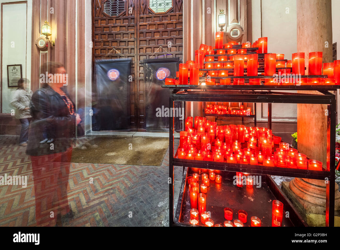 Votive candles devoted to San Judas Tadeo (Saint Jude Thaddaeus), Patron of Desperate causes in the Catholic tradition. San Anto Stock Photo