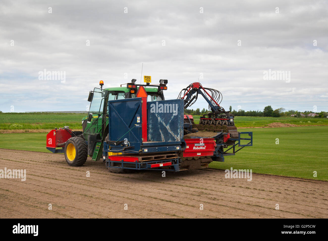 Brouwer RoboMax Automatic Roll Sod Harvester harvesting turf in