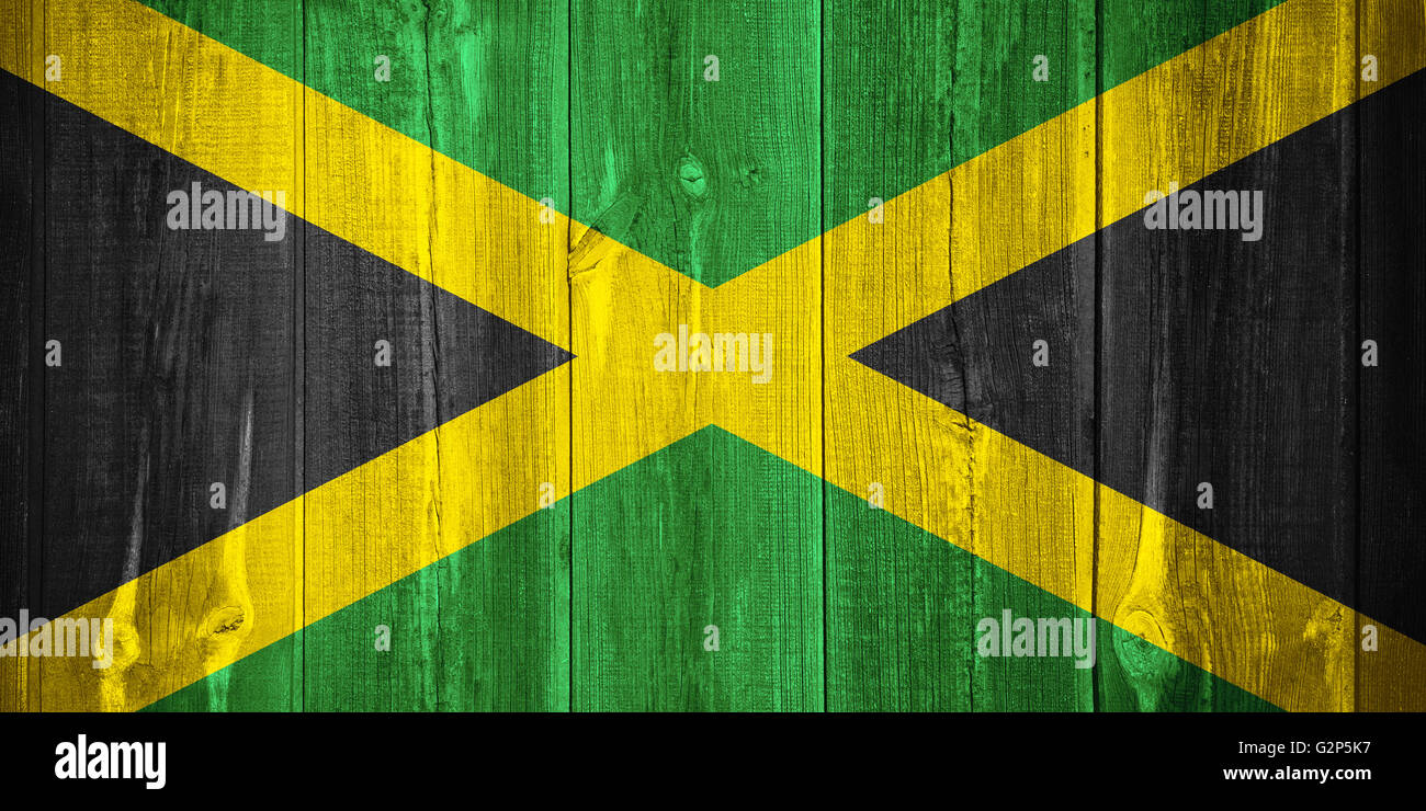 flag of Jamaica or Jamaican banner on wooden background Stock Photo