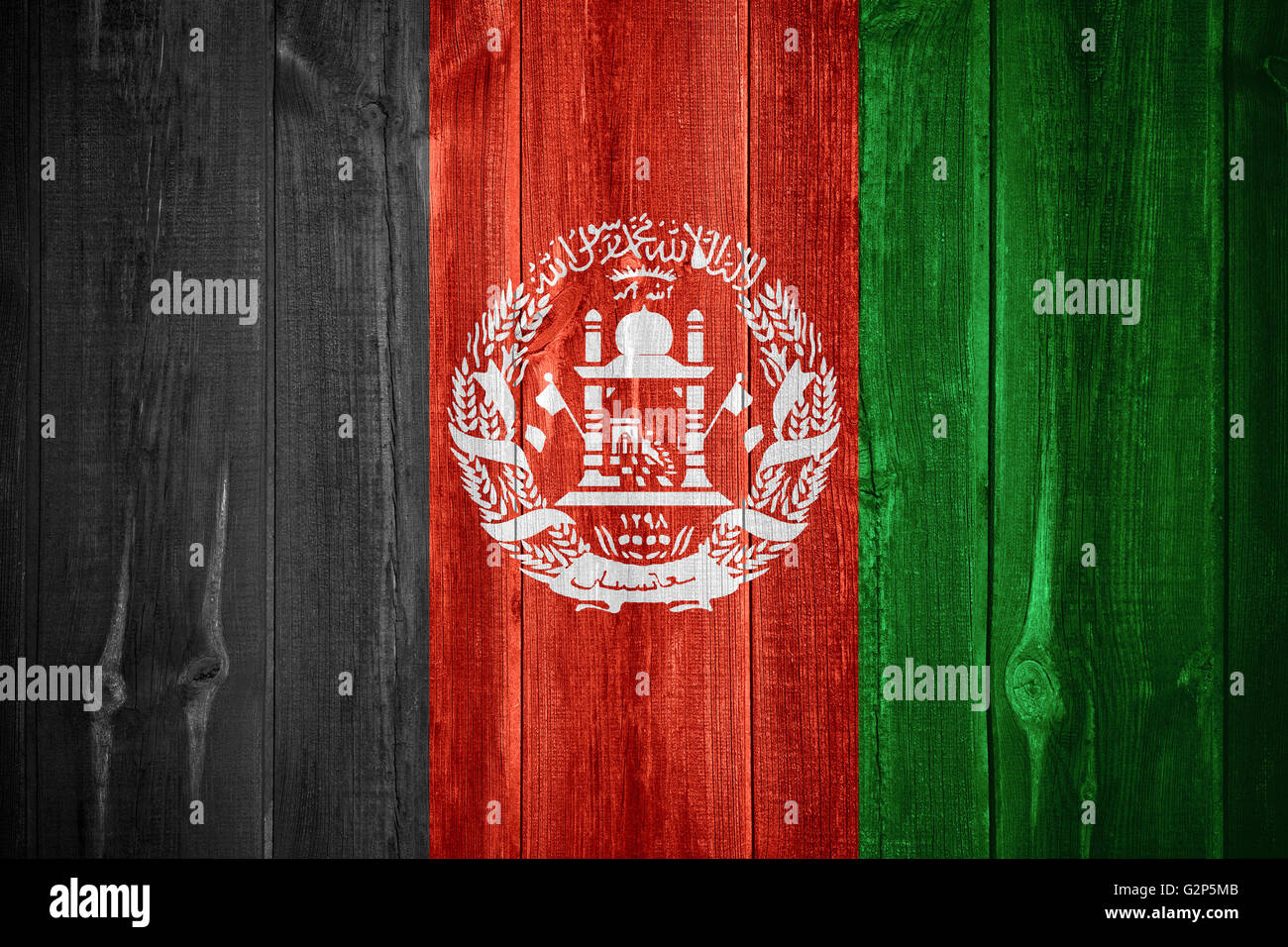 flag of Afghanistan or Afghan banner on wooden background Stock Photo