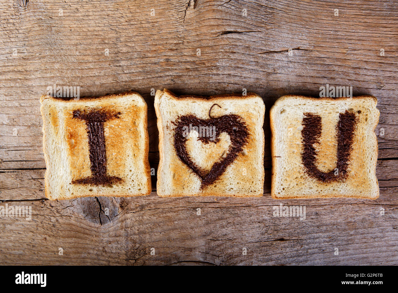 I Love You painted with hazelnut cream on white toast bread Stock Photo