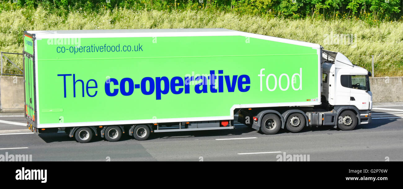 Co op transportation logistics food supply chain via supermarket food store delivery trailer & hgv lorry truck driving along English UK M25 motorway Stock Photo
