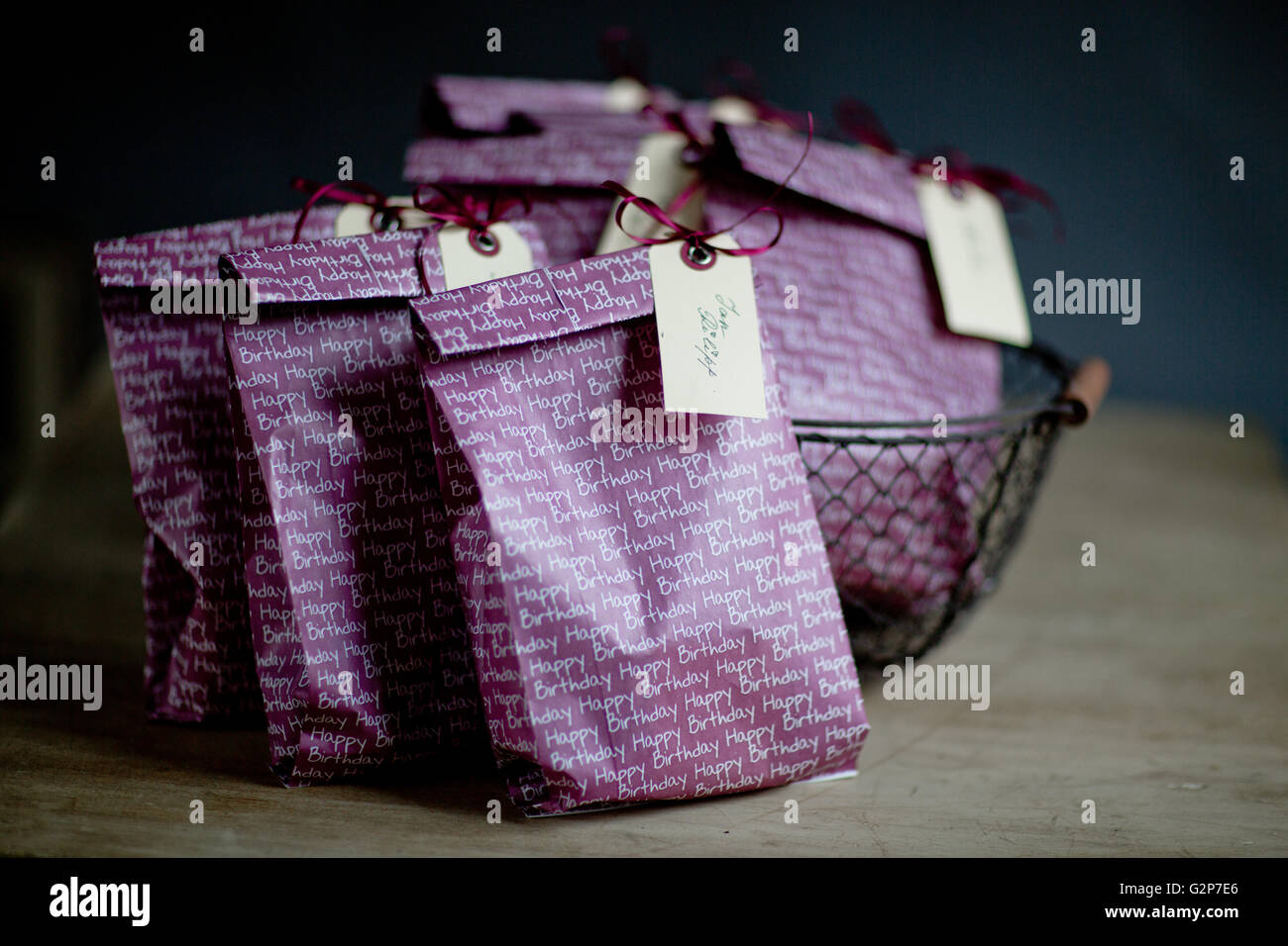 Violet Gift Bags with Name Tags at childs birthday party Stock Photo - Alamy