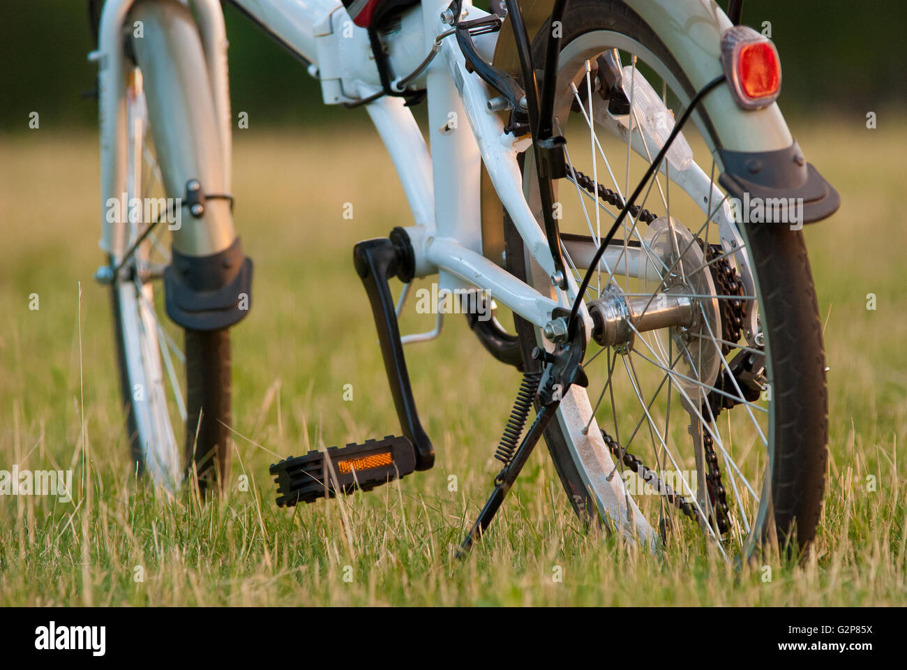 detail of bicycle closeup on grass field Stock Photo