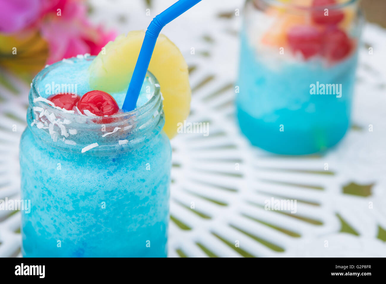 Close up of blue cocktail alcohol drink with fruit Stock Photo