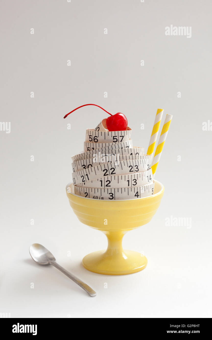 conceptual diet ice cream sundae made of measuring tape Stock Photo