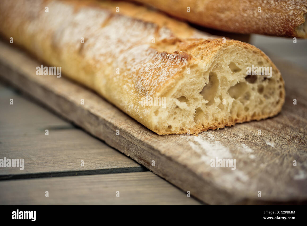 White French Bread on Wooden board Stock Photo