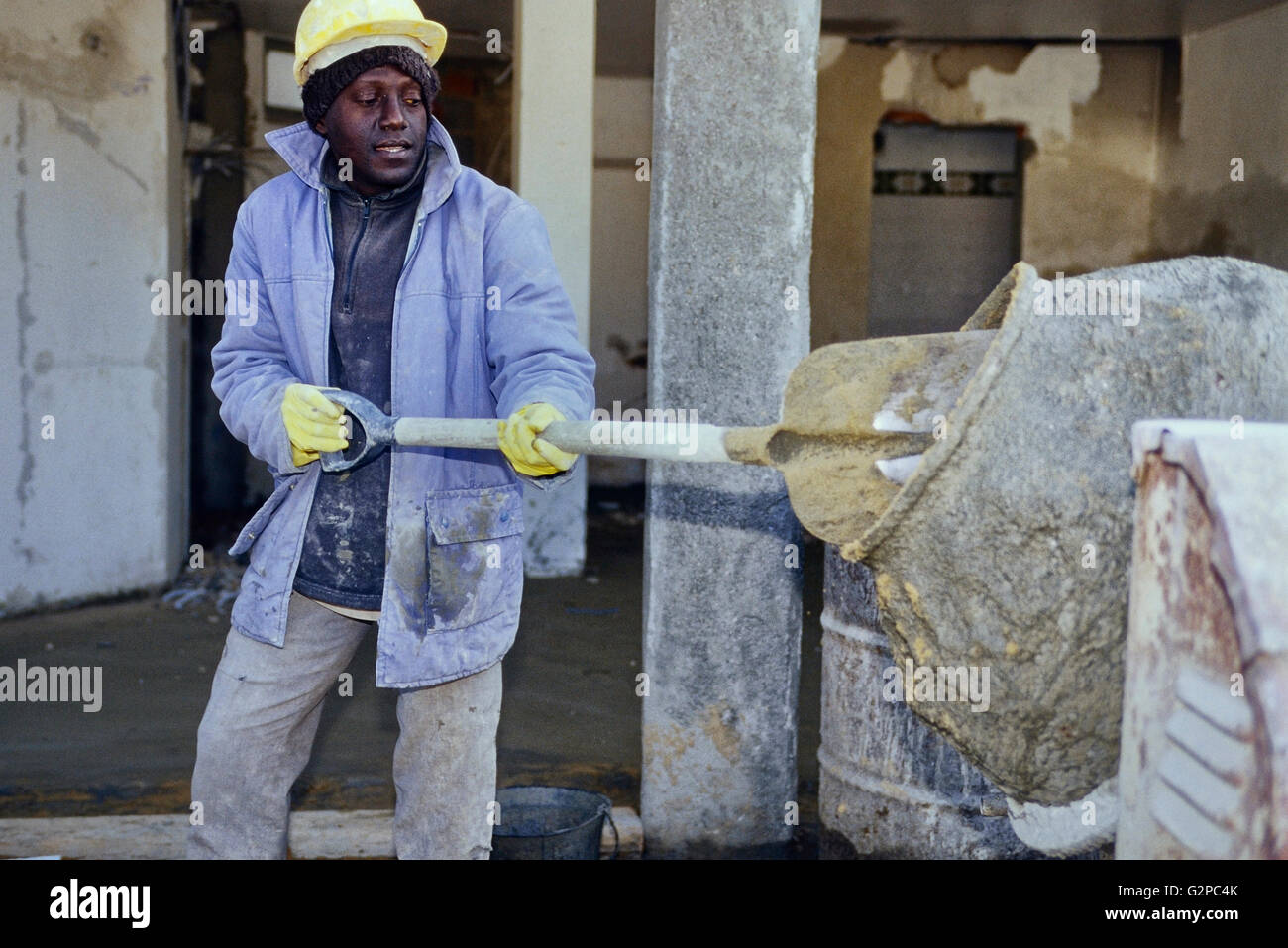 Red cement mix and trowel on the construction site Stock Photo - Alamy