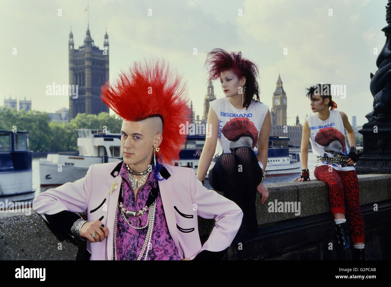 Matt Belgrano wearing a pink Teddy Boy Drape jacket and punk friends outside Parliament. London. England. UK. Europe Stock Photo