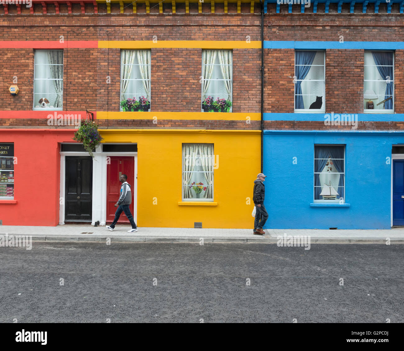 Bright coloured painted terrace houses on Baronet Street, Derry, Londonderry, Northern Ireland. UK. Europe Stock Photo