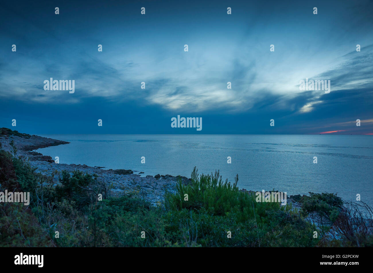 Razanj Croatia Europe. Landscape and nature photo. Adriatic Sea at dawn after sunset. Calm blue warm summer evening with beautiful colors and tones. Stock Photo