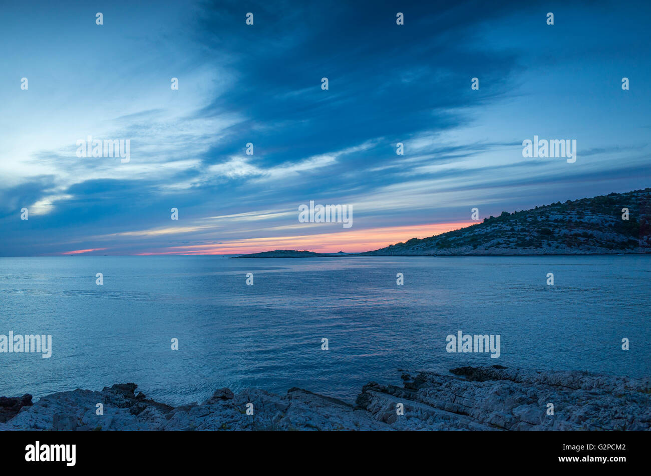 Razanj Croatia Europe. Landscape and nature photo. Adriatic Sea at dawn after sunset. Calm blue warm summer evening with beautiful colors and tones. Stock Photo