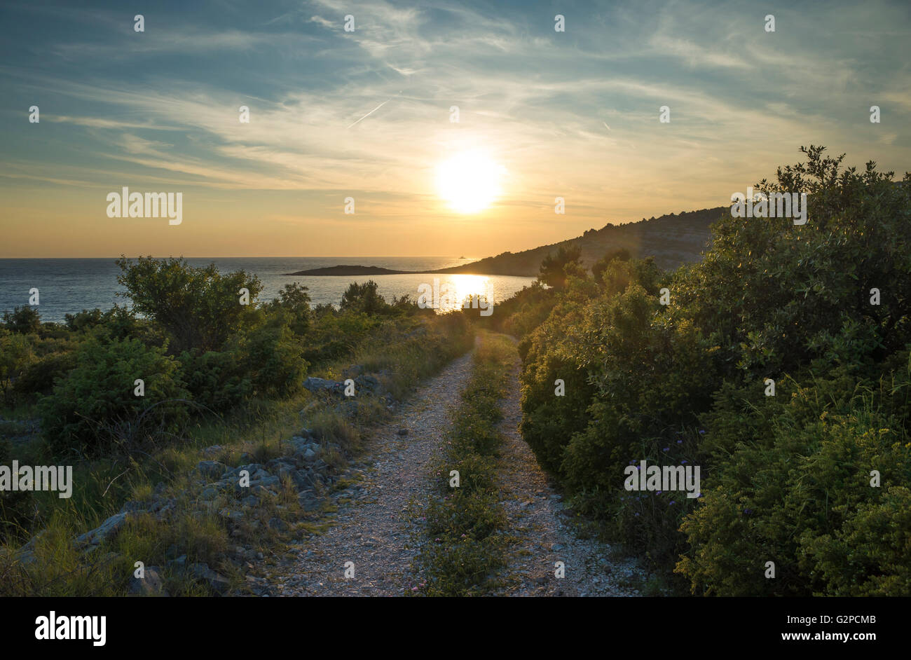 Razanj Croatia Europe. Landscape and nature photo. Adriatic Sea and a road. Calm warm summer evening with beautiful colors and tones. Sunset photo. Stock Photo
