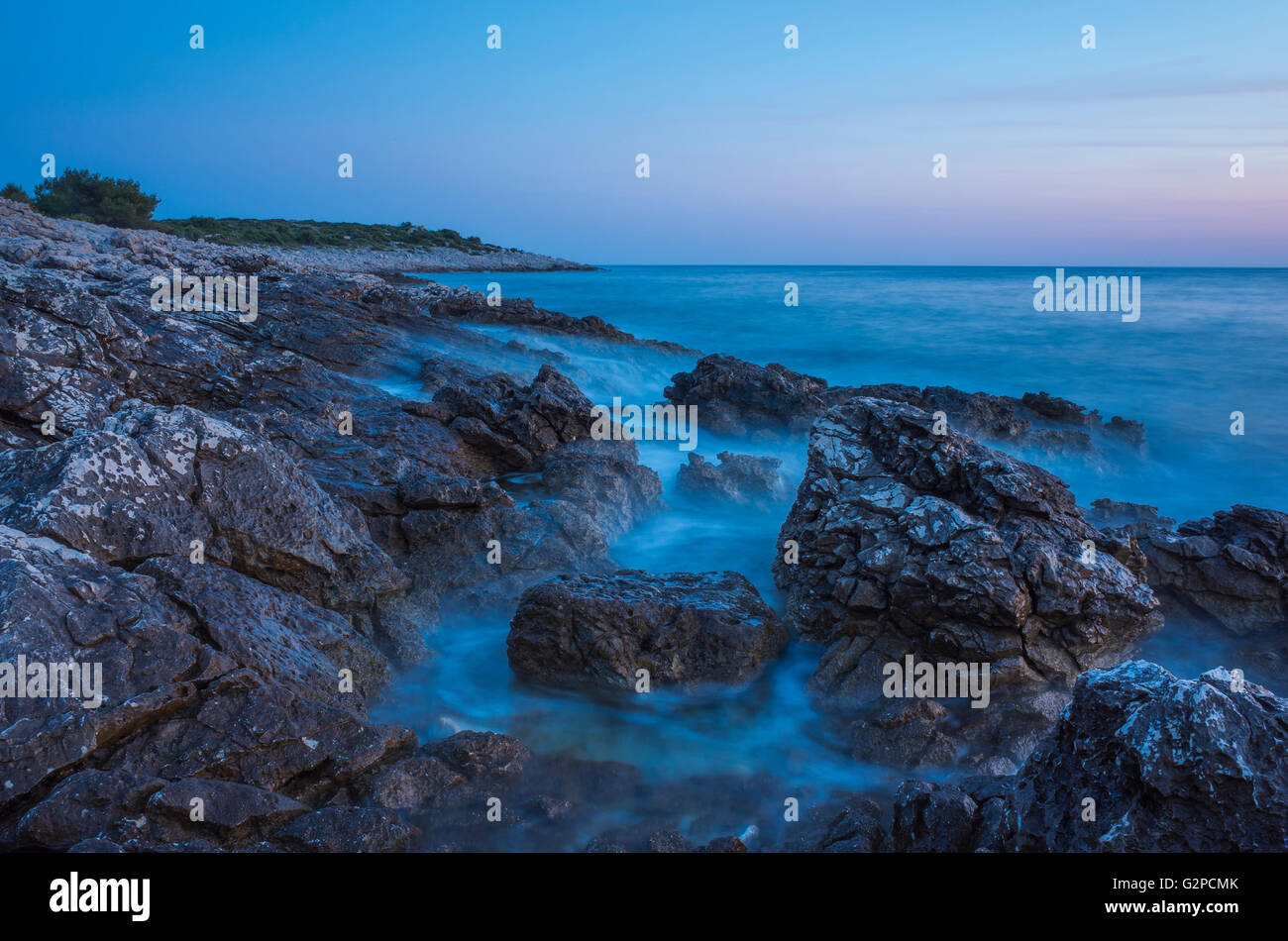 Razanj Croatia Europe. Landscape and nature photo. Adriatic Sea at dawn after sunset. Calm warm summer evening with beautiful colors and tones. Stock Photo