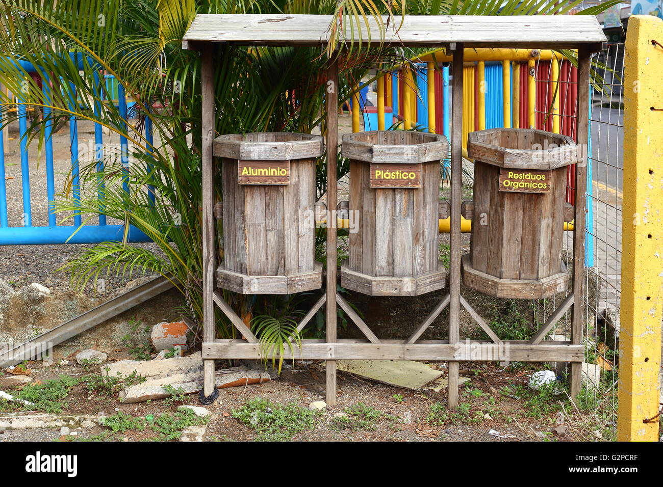 Wooden trash recycling bins with text in Spanish Stock Photo Alamy