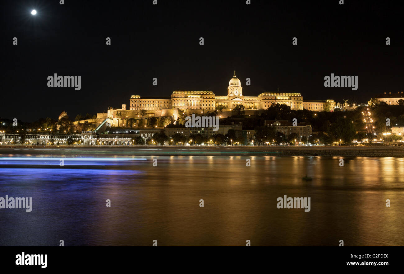 Buda Castle ( Royal Palace ) by the Danube river illuminated at night ...