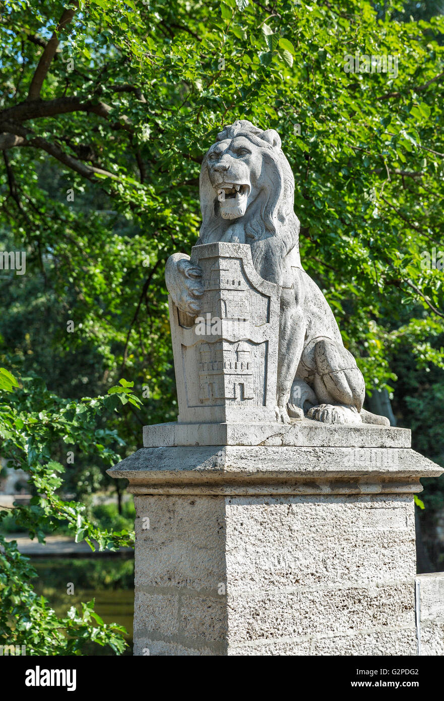 Lion statue in front of Vajdahunyad Castle, City Park of Budapest, Hungary. Stock Photo