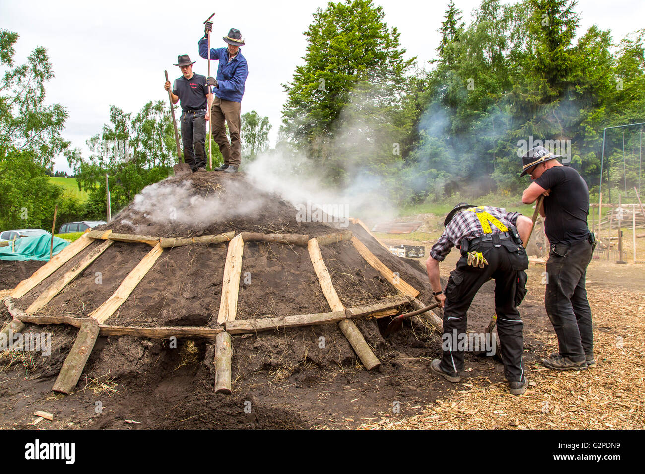 Running, burning, of a traditional charcoal kiln in WinterbergZüschen