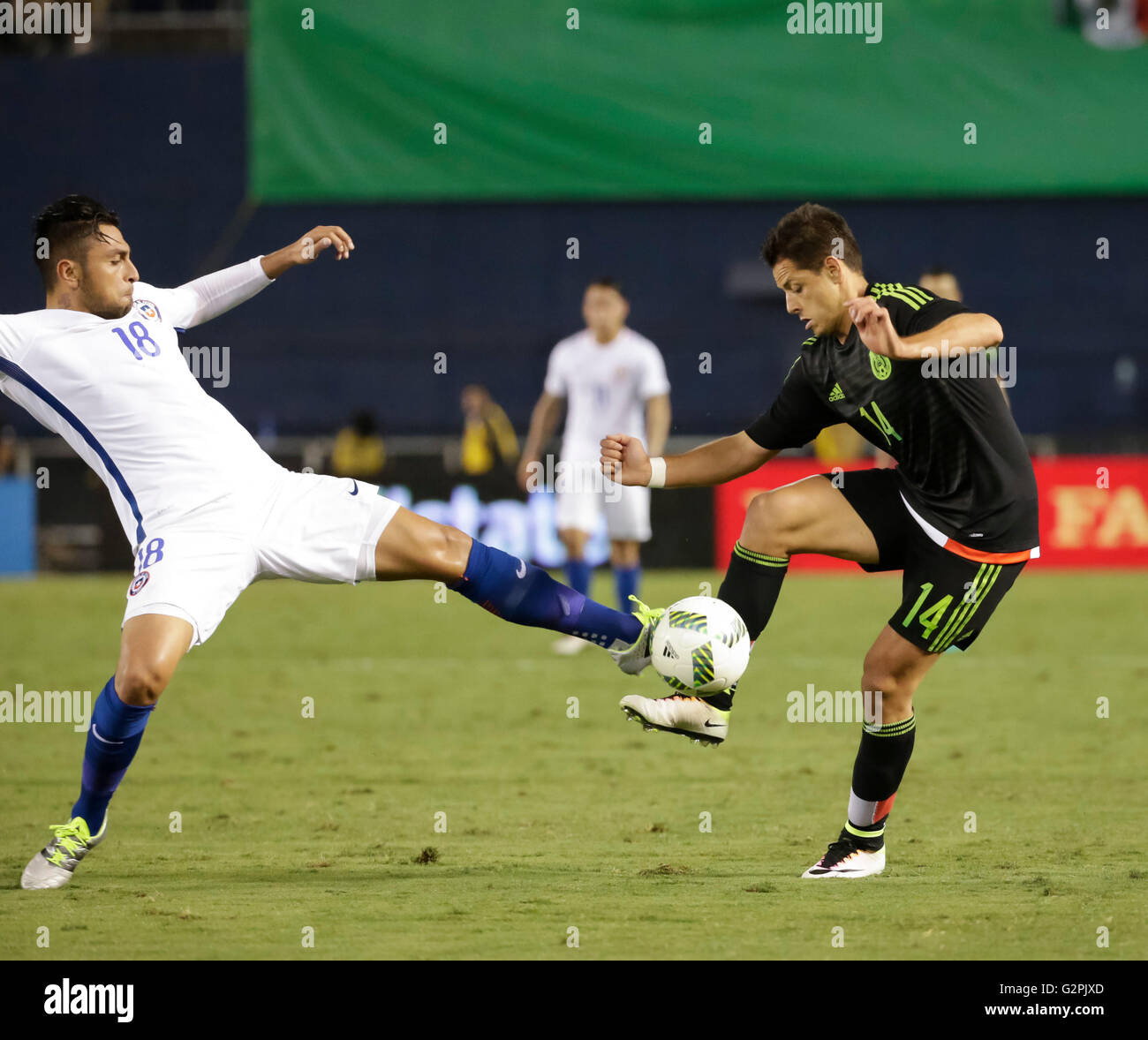 San Diego, California, USA. 01st June, 2016. Mexican Forward #14 Javier ''Chicharito'' Hernandez tries to handle the ball around Chilean #18 Gonzalo Jara during an international soccer match between Mexico and Chile at Qualcomm Stadium in San Diego, California. Mexico defeats Chile 1-0. Justin Cooper/CSM/Alamy Live News Stock Photo