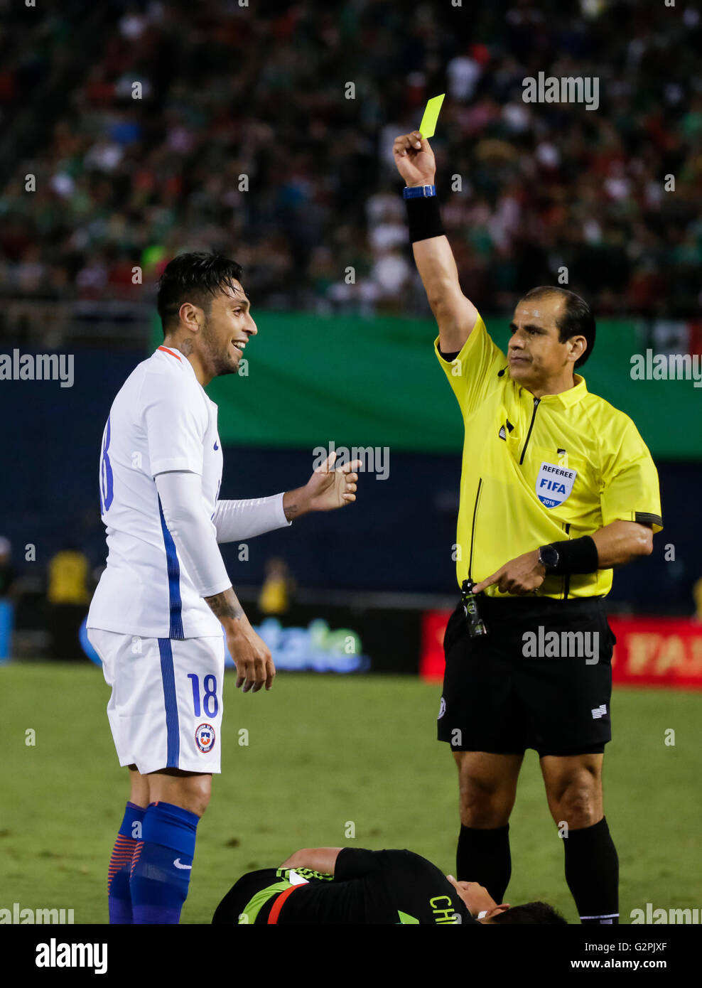 San Diego, California, USA. 01st June, 2016. Chilean #18 Gonzalo Jara is yellow carded for his penalty against Mexican Forward #14 Javier ''Chicharito'' Hernandez during an international soccer match between Mexico and Chile at Qualcomm Stadium in San Diego, California. Mexico defeats Chile 1-0. Justin Cooper/CSM/Alamy Live News Stock Photo