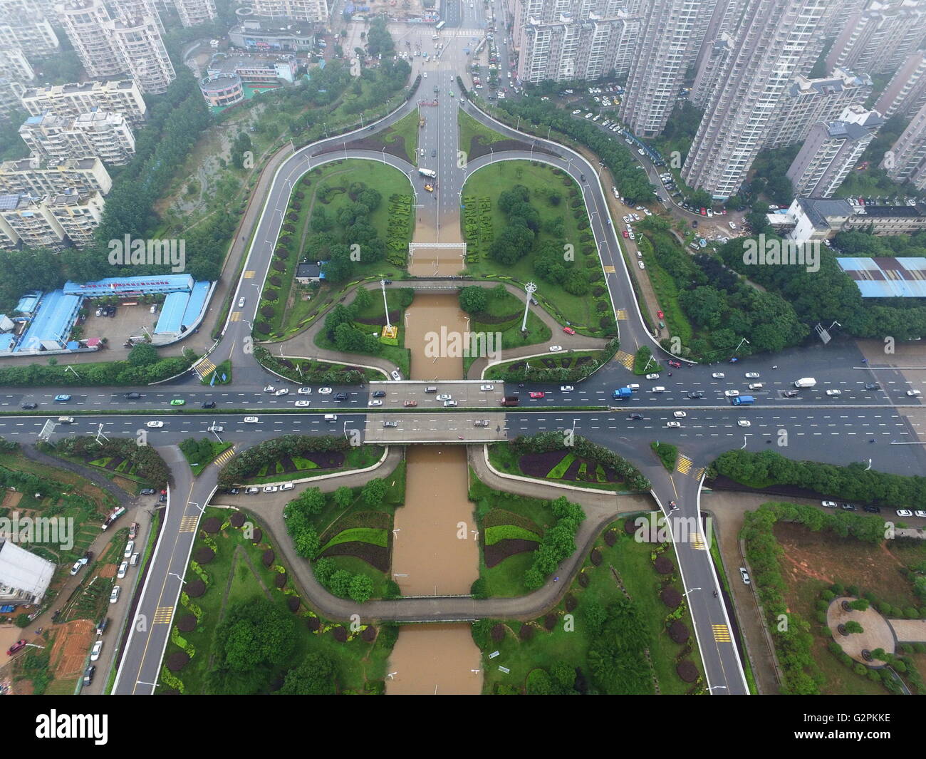 Nanchang. 2nd June, 2016. The aerial photo taken on June 2, 2016 shows waterlogged road under the Fenghe Brigde in Nanchang, capital of east China's Jiangxi Province. Heavy rainfall hit Nanchang Thursday, and water logging hindered the city's traffic. Credit:  Zhou Mi/Xinhua/Alamy Live News Stock Photo
