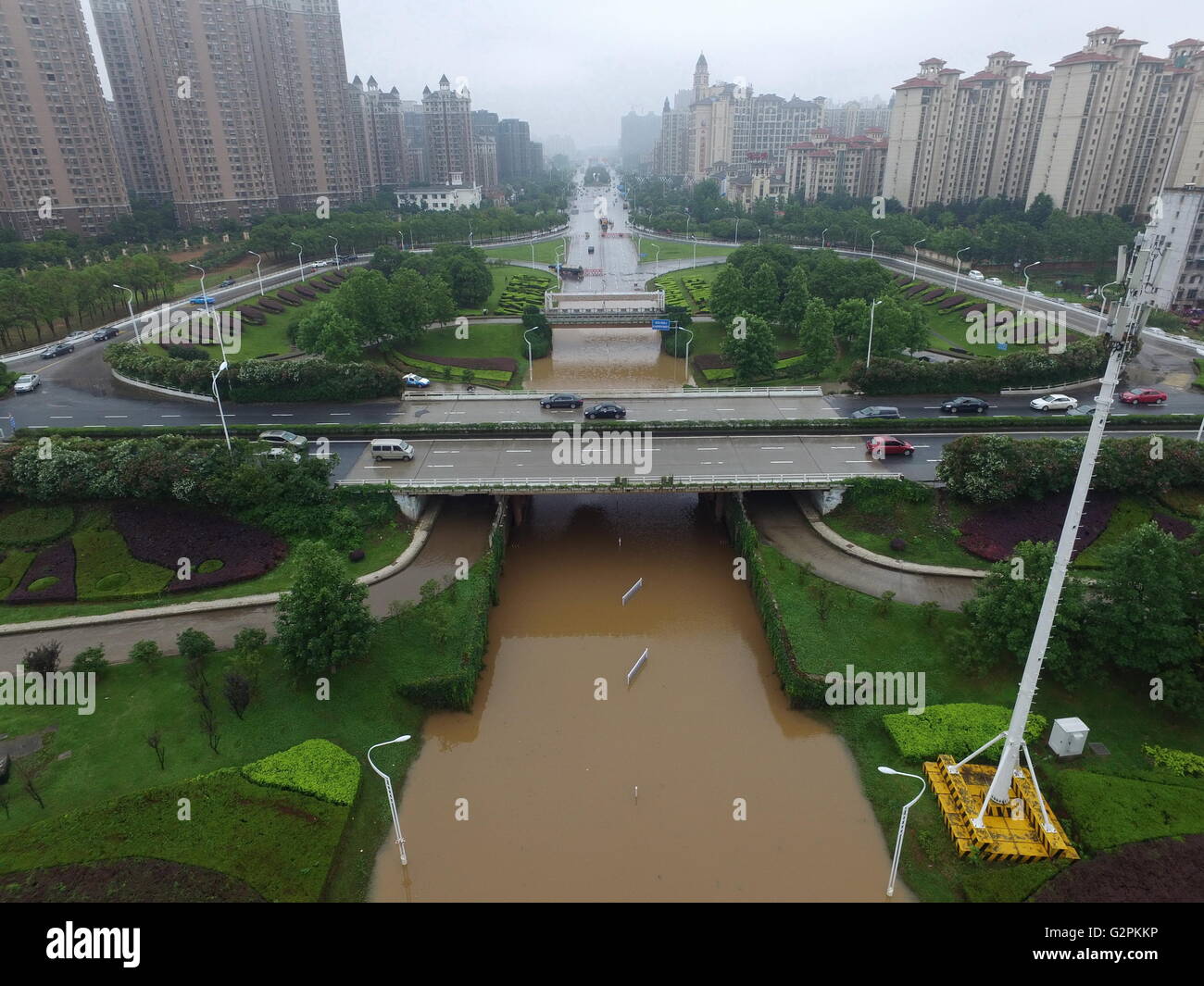 Nanchang. 2nd June, 2016. Photo taken on June 2, 2016 shows waterlogged road under the Fenghe Brigde in Nanchang, capital of east China's Jiangxi Province. Heavy rainfall hit Nanchang Thursday, and water logging hindered the city's traffic. Credit:  Zhou Mi/Xinhua/Alamy Live News Stock Photo