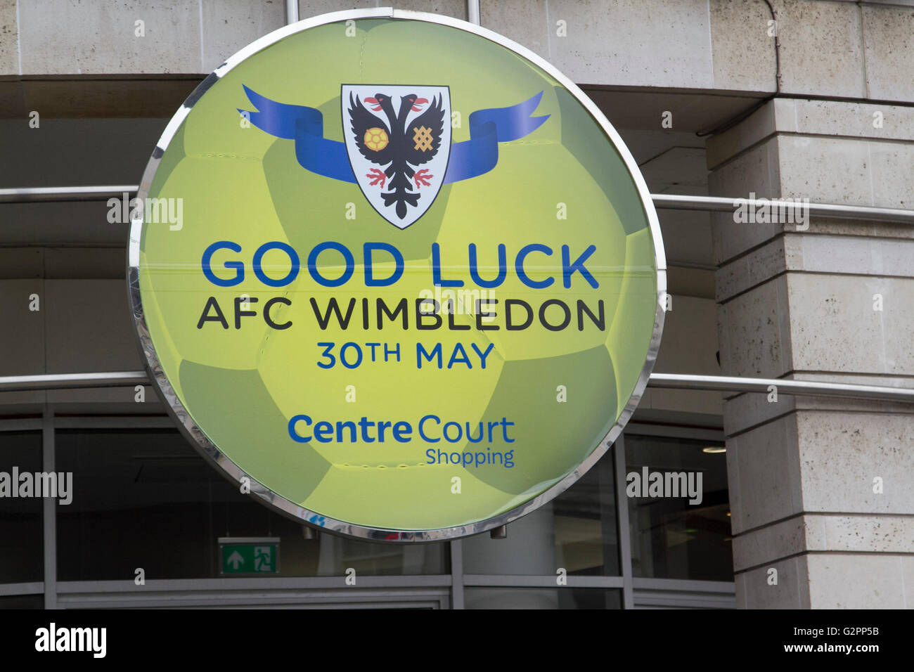 Wimbledon London, UK. 2nd June 2016. A large sign outside Centre Court shopping mall in Wimbledon town centre extending good luck wishes to AFC Wimbledon after gaining promotion to League One in a playoff final at Wembley stadium against Plymouth on 30th May for the first time in the club's history since it was founded in 2002 Credit:  amer ghazzal/Alamy Live News Stock Photo