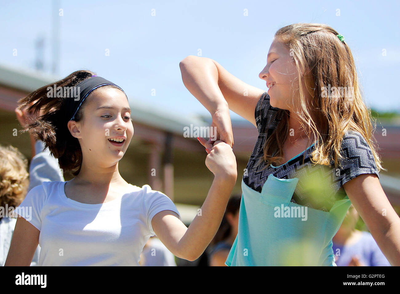 Napa, CA, USA. 1st June, 2016. River School students Sophie Lair, left, and Shelby Morse dance in the River Courtyard at the school's first International Festival on Wednesday. © Napa Valley Register/ZUMA Wire/Alamy Live News Stock Photo