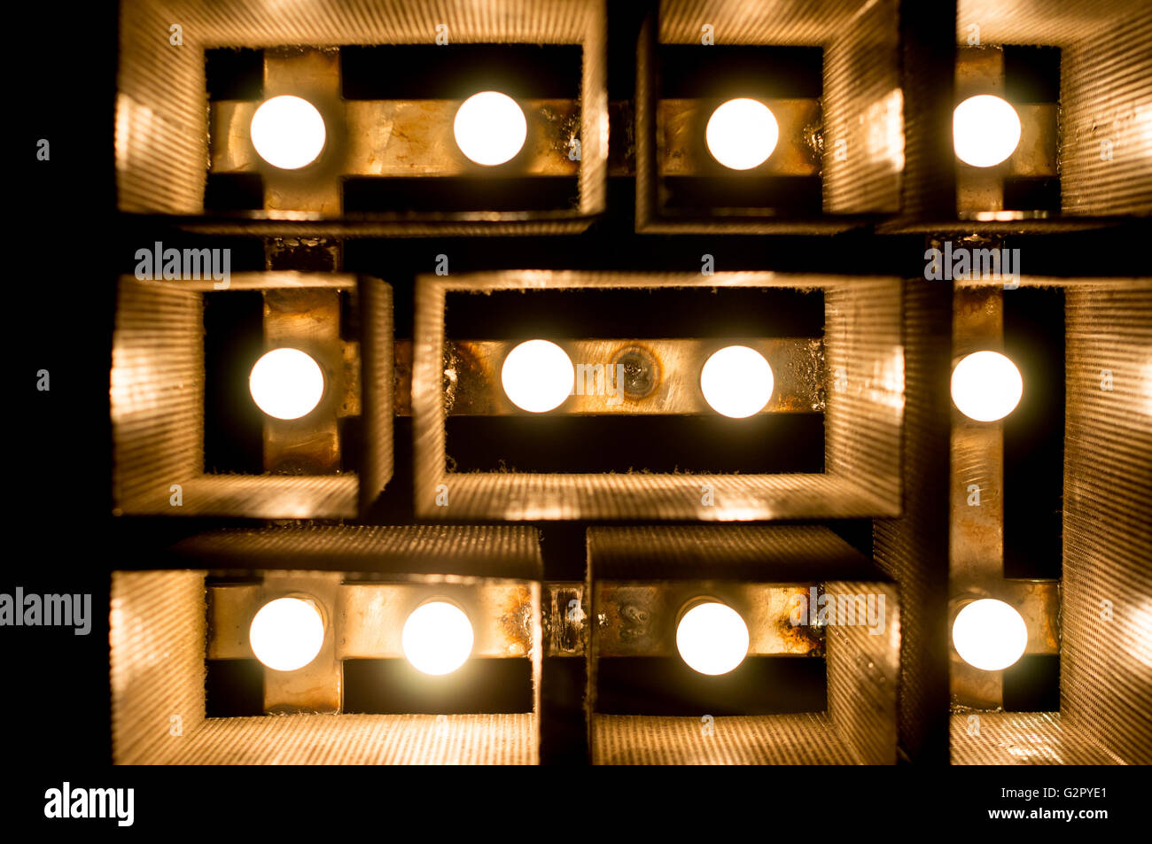 decorative indoor lights with a rectangular design and golden shades Stock Photo