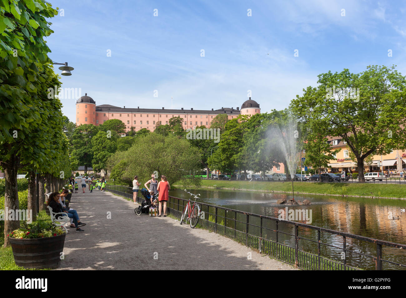 Uppsala, Sweden - Jun 1, 2016 : Swan pond against the Uppsala Castle. Stock Photo