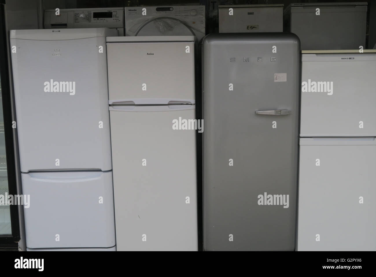 Fridges/Freezers and washing machines for sale outside an electrical appliance shop Stock Photo