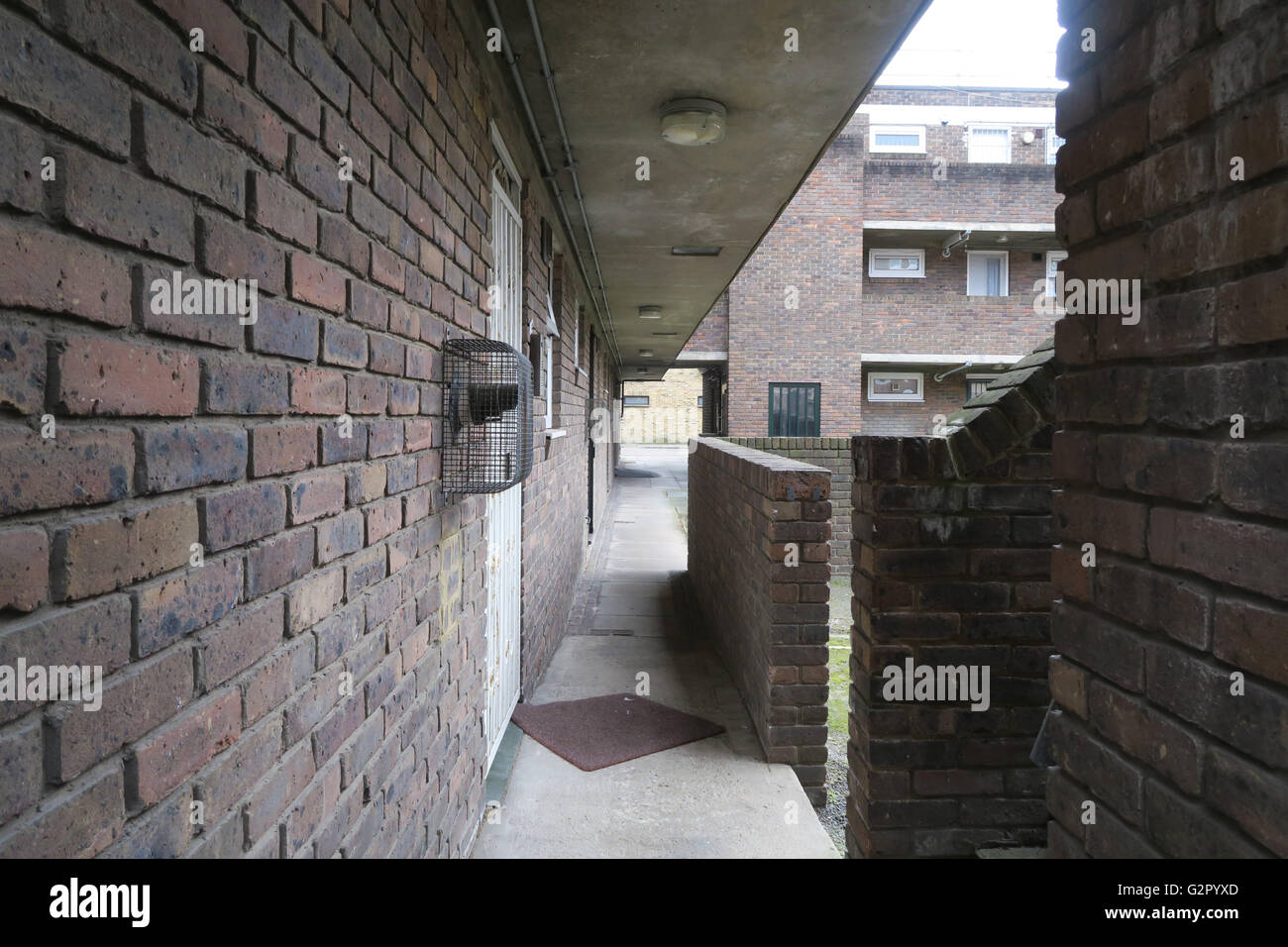 Side alley of a housing/council estate, stairwell, balconies. Stock Photo
