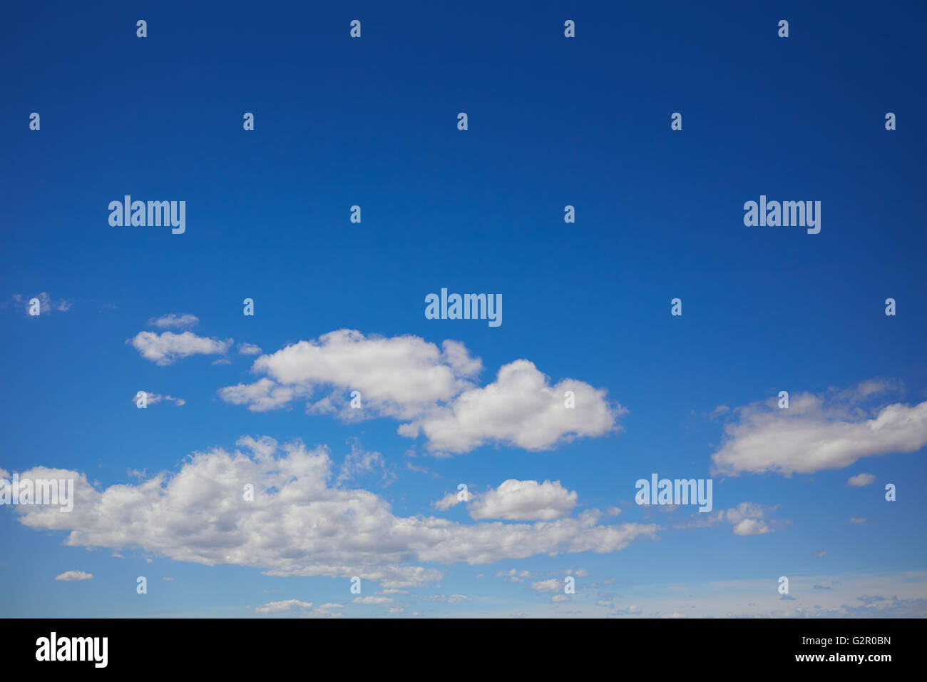 Blue summer sky in Mediterranean sea with white clouds Stock Photo