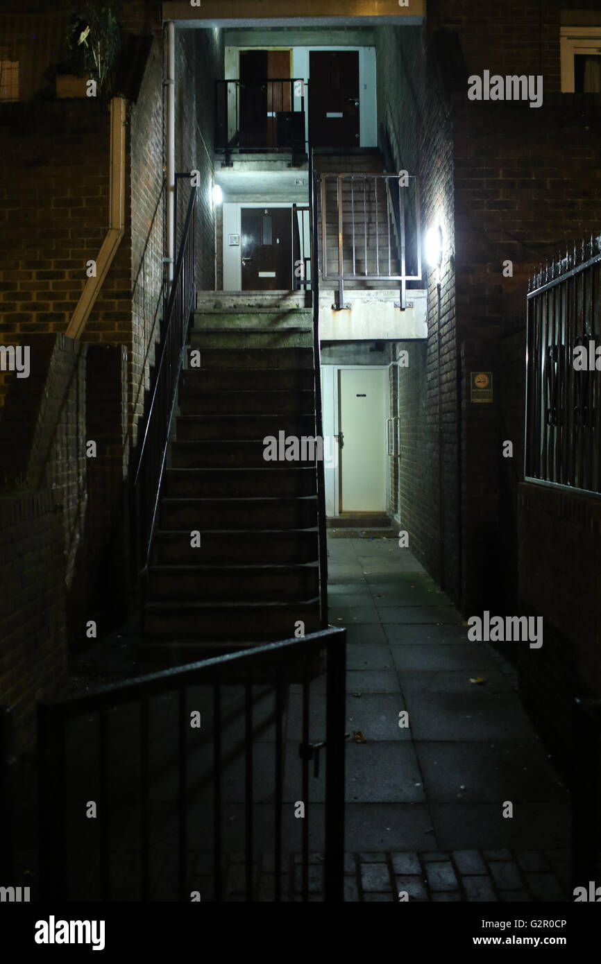 dimly lit stairwell, alley on a council housing estate in Archway, London Stock Photo