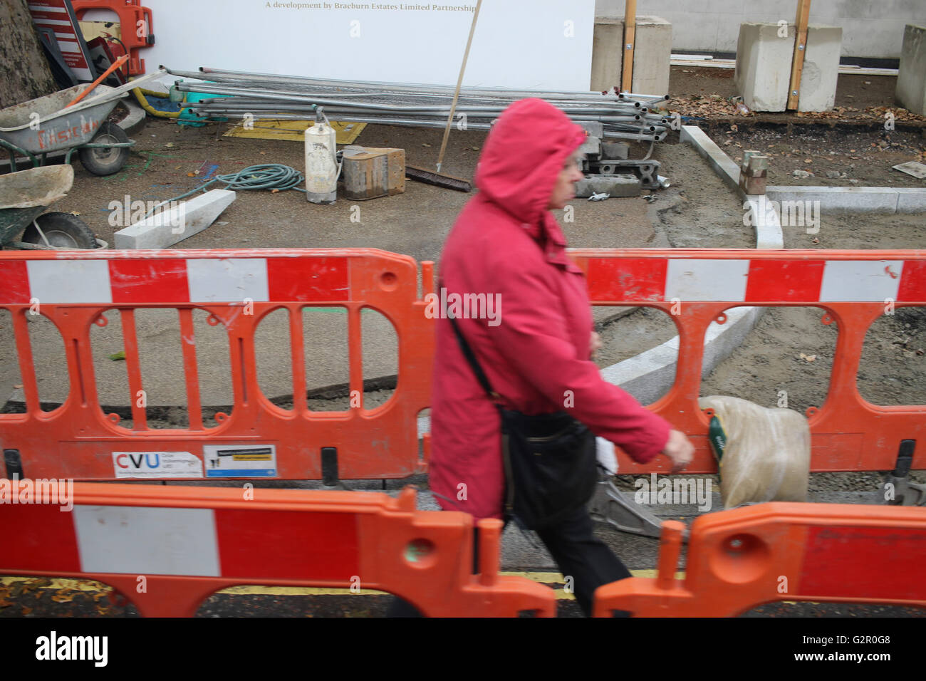 Woman in red walks through hi-res stock photography and images - Alamy