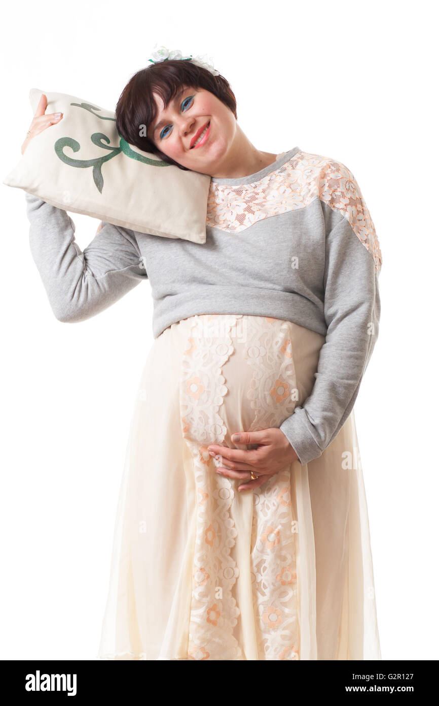 Concept happy sleepy pregnant woman. Isolated white background. Stock Photo