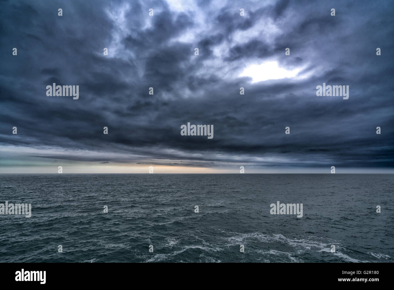 Dark stormy cloud above the sea, dark tone nature abstract Stock Photo