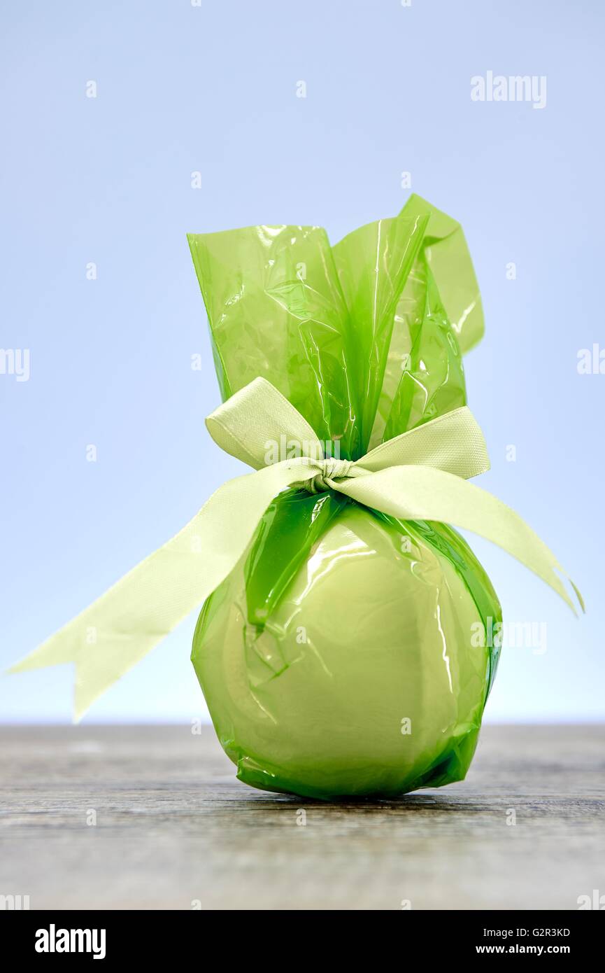 A studio photo of a gift wrapped in cellophane Stock Photo Alamy