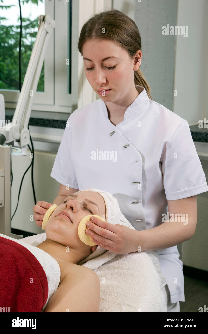 Beautician at work in a cosmetics institute Stock Photo