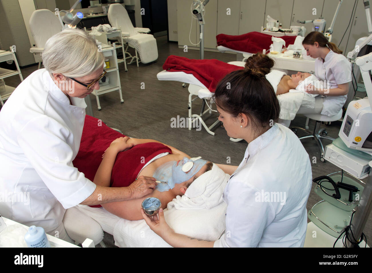 Beautician at work in a cosmetics institute Stock Photo