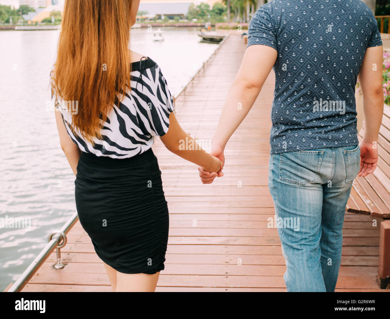 Teen couple walking holding hands hi-res stock photography and images ...