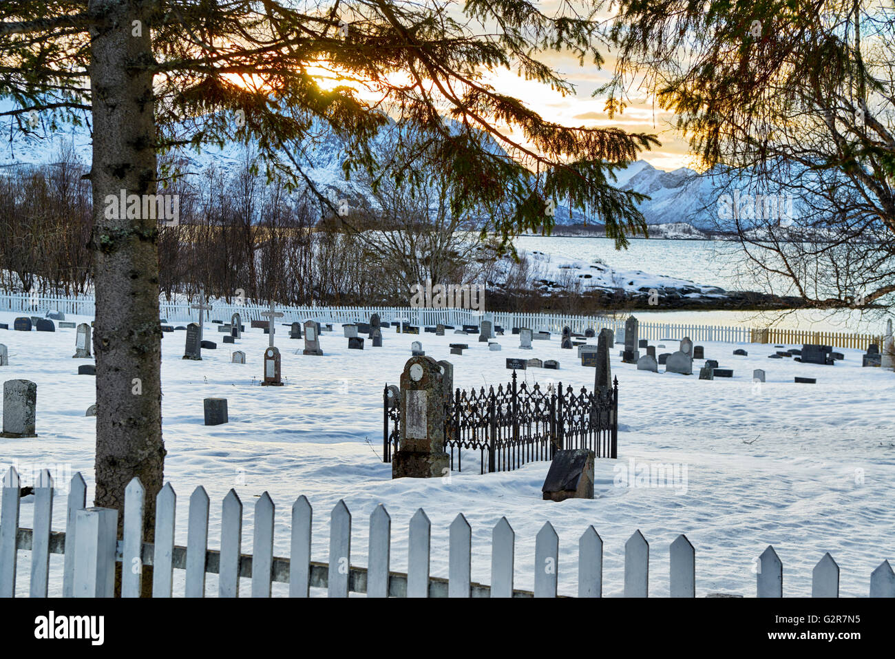 graveyard in winter landscape of Bergsfjorden, Senja, Skaland, Troms, Norway, Europe Stock Photo